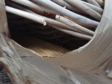 a basket that has a bunch of sticks inside of it