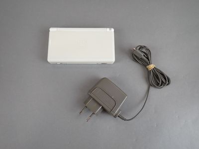 a white box with a power cord and a charger on it