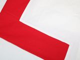 the bottom of a red and white shirt with white trims