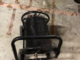 a black chair that is on the floor in the room