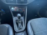 the interior of a car with a dashboard and a steering control