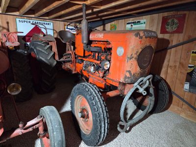 a tractor that is sitting in a garage