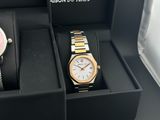 two watches that are in a box on the table