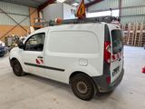 a white van that is parked in a garage
