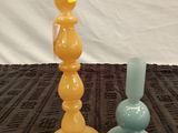two vases sitting on a table with a price tag on them