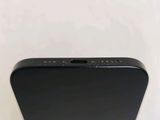 the back view of a black iphone with a white background