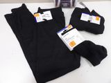 three pairs of black pants sitting on a table