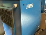 a blue air conditioner sitting on top of a pallet in a warehouse