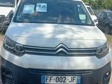 the front of a silver citrole parked in a parking lot
