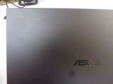 a laptop that is sitting on a table with a mouse