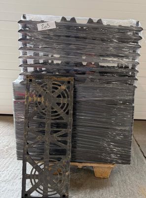 a stack of metal items on a pallet in a warehouse