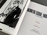 an open book with a drawing of a man in a suit