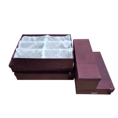 a wooden box with a white cloth inside of it