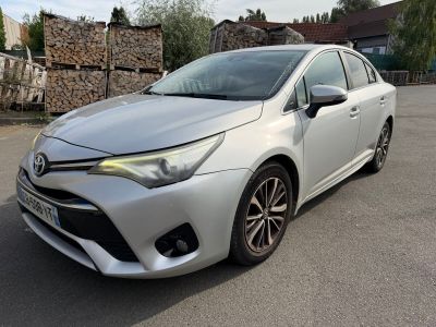 the toyota corollant is parked in a parking lot
