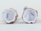 pair of porcelain figurines of shells with blue and white decoration