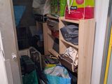 a small closet with a lot of items in it