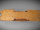 an image of a piece of wood with holes cut out of it