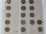 a lot of coins in a clear bag on a table