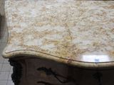 a marble table with a drawer underneath it in a room