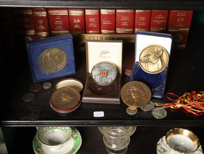 a glass case with a lot of coins on it
