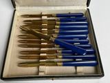 an image of a box with a bunch of pens in it