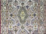 an antique persian rug with a floral design