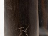 two wooden vases sitting on top of each other on a white surface