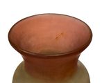 a brown vase with a brown base on a white background