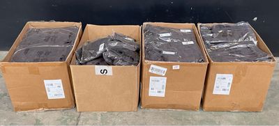 several boxes filled with assorted items sitting on top of a cement floor