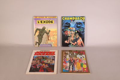 three comic books sitting on top of a table next to each other
