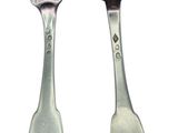 two spoons and a fork on a white background