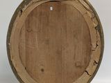 an old wooden barrel sitting on top of a white surface