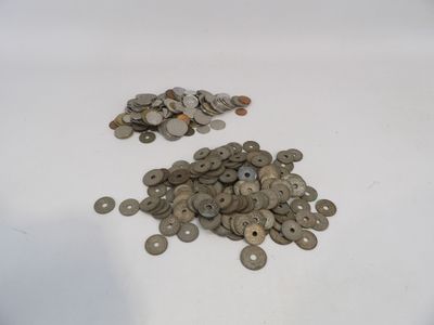 a pile of coins sitting on top of a white table
