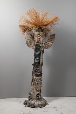 a sculpture of an elephant with a mohawk on it ' s head