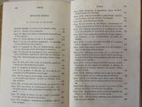 an open book on a table with a number of pages on it