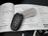 a car key sitting on top of a book with a car key on top of it