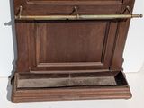 an old wooden clock on display on the wall