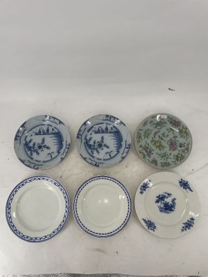 six blue and white plates with floral designs on them on a table