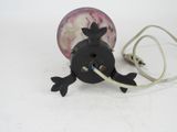 a small black object with a white cord attached to it