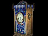 a clock that is sitting on a stand in the dark