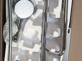 a box with a shower head and a hand shower