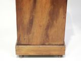 a small wooden box with a handle on a stand
