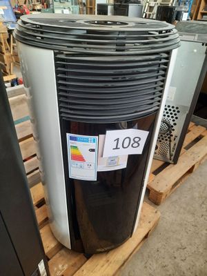 a black and white air conditioner sitting on a pallet