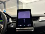 a tablet that is sitting in the dashboard of a car