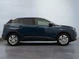 the blue car is parked in the garage on the concrete floor
