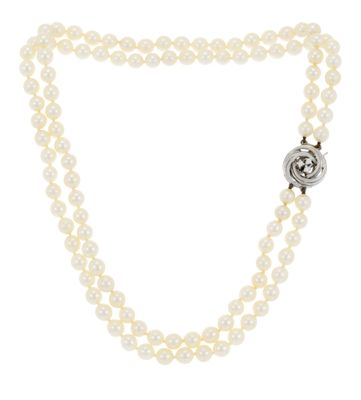 a white pearl necklace with a silver clasp