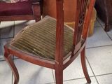a chair that is sitting in the middle of a room