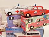 several toy cars are stacked on top of each other on a table