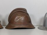 three helmets sitting next to each other on a table