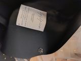 a black motorcycle with a label on the seat